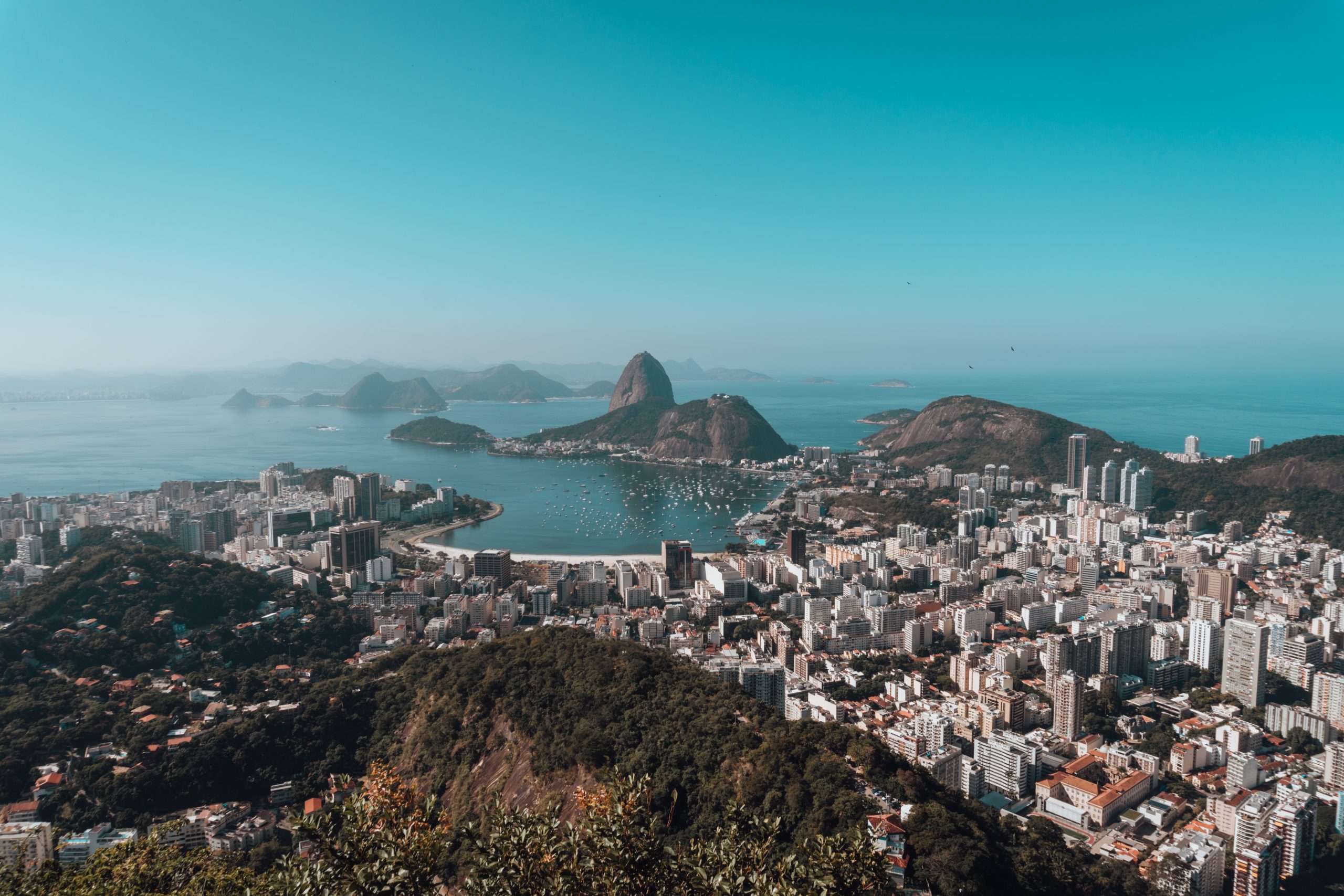 landscape-rio-de-janeiro-surrounded-by-sea-blue-sky-brazil-scaled
